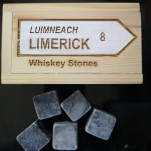Set of whiskey stones in wooden box engraved with a road sign saying Limerick