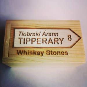 Set of whiskey stones in wooden box engraved with a road sign saying Tipperary